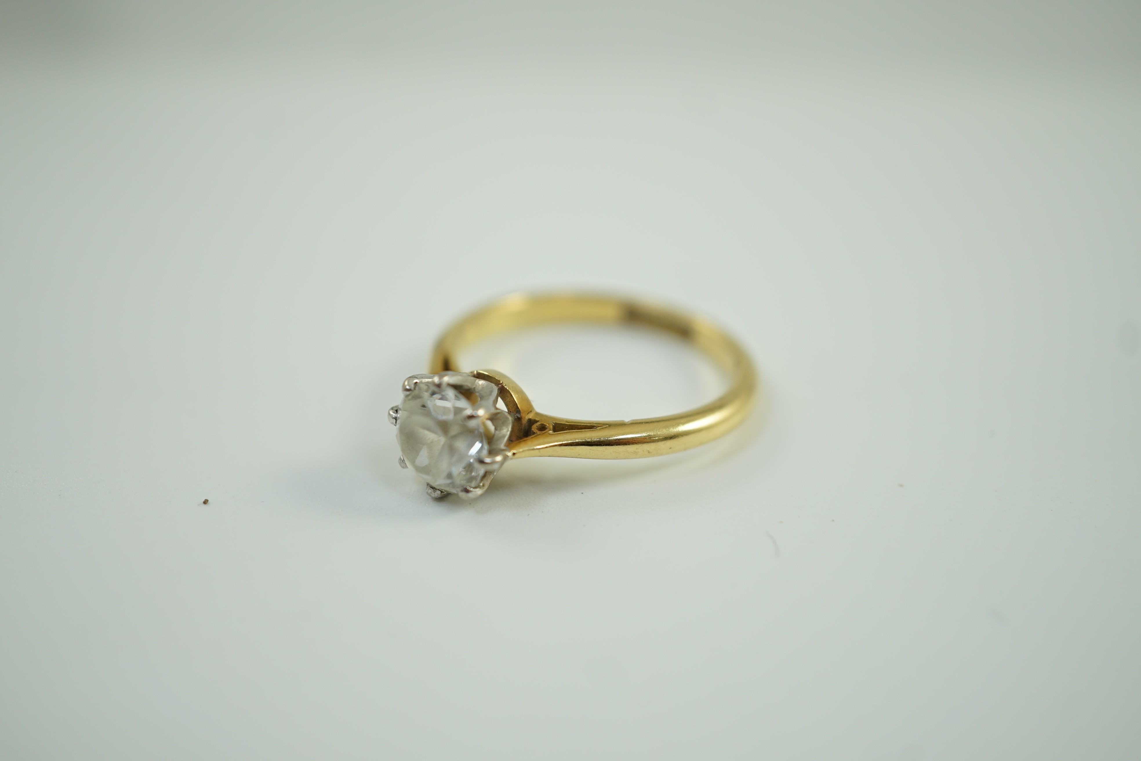 An 18ct, plat and single stone white zircon? set ring, size R, gross weight 4.8 grams.